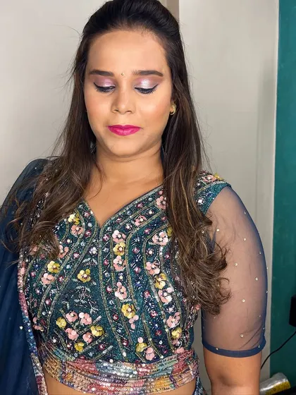 The eye makeup is the focus here, with beautifully blended colors that make her eyes sparkle.