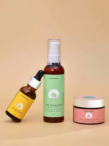 A simple group shot of the Moon Forest skincare line against a neutral background. This image clearly displays the product range for catalog or website use.