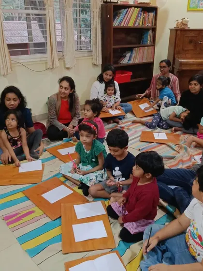 The group gets ready for a craft activity following the anniversary story session.