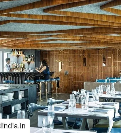 The main dining hall of the Queensline Sea Yah. To address the long, low-height space, I designed a tree-like ceiling structure from teak wood, creating a rhythmic and organic form that defines the restaurant's interior character while preserving views of the water.