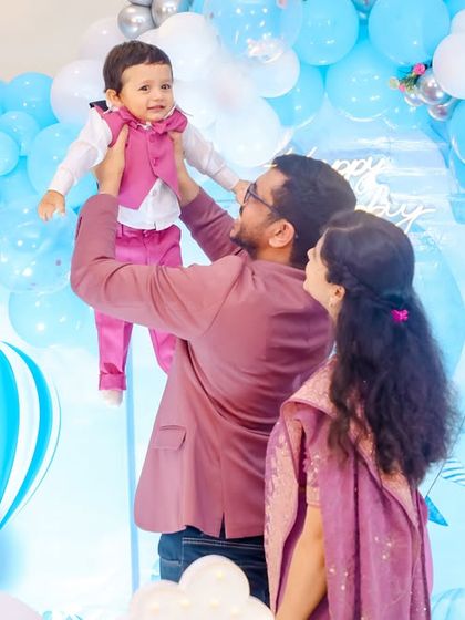 A thrilling 'Hot Wheels' themed birthday party, with checkered flags, car cutouts, and a custom racetrack backdrop, perfect for little speed enthusiasts.