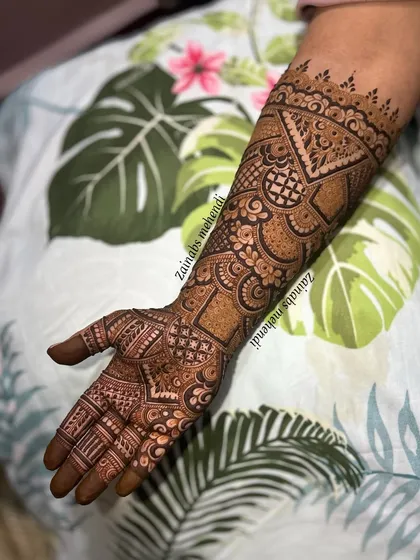 The full arm view of this unique geometric bridal henna.