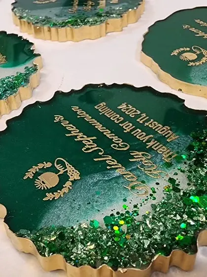 A set of green and gold geode style magnets, customized for Daniel Stephen's Holy Communion.