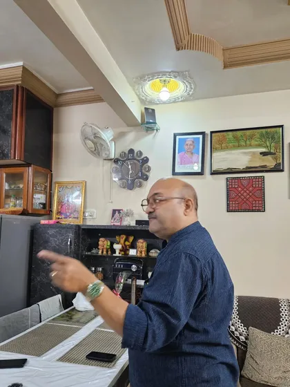 Pointing out a Vastu flaw in the dining and living area of a home. My job is to find the root cause of the problem and provide a simple solution.