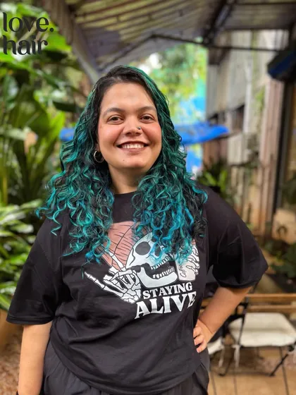 For those who want to go bold, we love playing with vivids. This vibrant green hair colour was achieved with a careful bleach and tone process to make a statement while protecting the integrity of the curls.