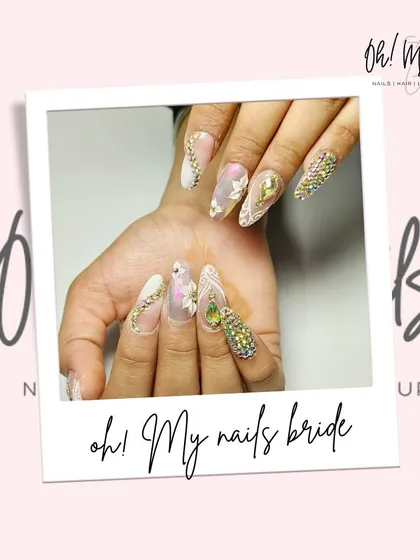 This is what bridal nail dreams are made of. We crafted this exquisite set with detailed 3D floral work, delicate lace patterns, and a full crystal accent nail for a bride who wanted nothing less than perfection on her special day.