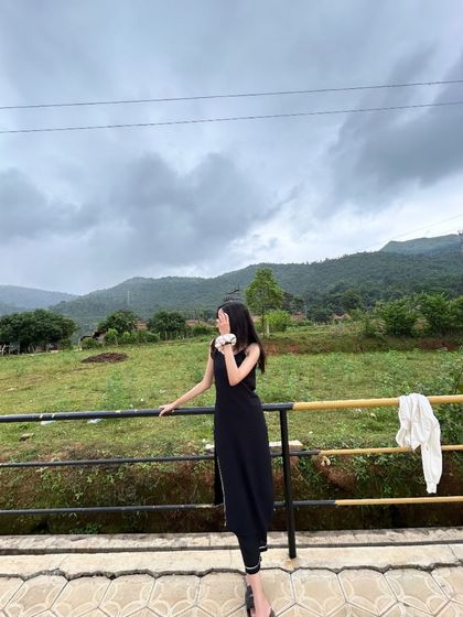 A traveler enjoying the view from a balcony at the homestay near Netravathi.