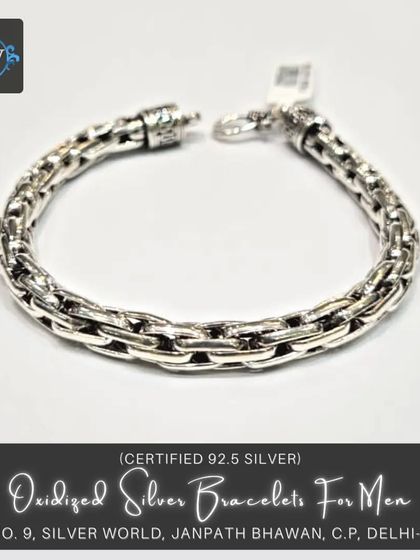This men's bracelet features a double-layered link design with an oxidized finish. It's a solid, durable piece that adds texture and character to your wrist.