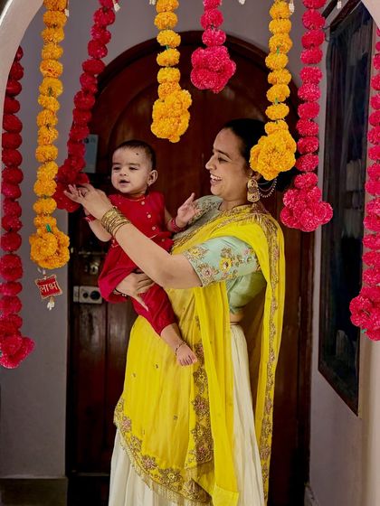 A festive photo of me and Gauri during Diwali, surrounded by marigold decorations. This image captures the bright, happy colors of the festival and is perfect for seasonal brand campaigns.