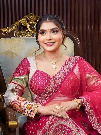 A full view of this radiant look. The pink lehenga with intricate embroidery is paired with makeup that is natural yet glamorous.