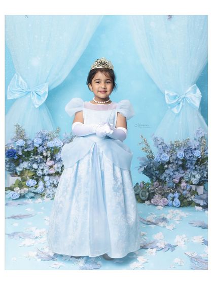 A little princess in her element. This beautiful Cinderella-themed portrait is perfect for capturing the fairytale dreams of childhood.
