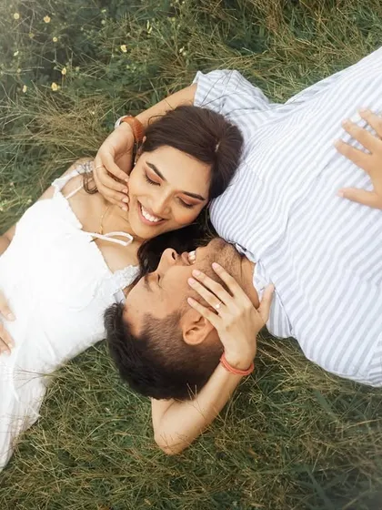 Sometimes the most profound moments are the quietest. This overhead couple portrait, taken as they lay together in a field of wildflowers, captures a feeling of peace and deep affection, showcasing the tender side of their love story.
