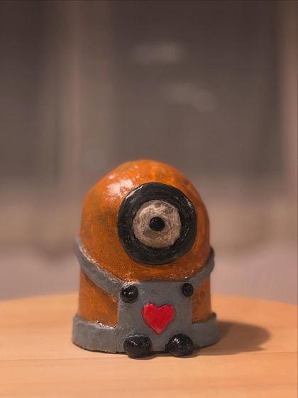 A finished Minion sculpture, painted and glazed. This little guy is ready to bring some fun and nostalgia to jego new home.