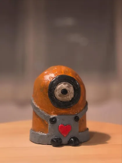 The finished, painted Minion sculpture. The bright colors and glossy finish bring this fun character to life.