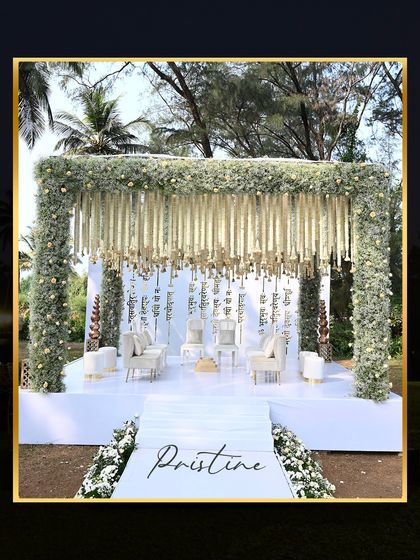 This pristine white mandap at ITC Goa was designed for an ethereal, heavenly feel. The clean lines and lush white florals create a serene and elegant space for exchanging vows.