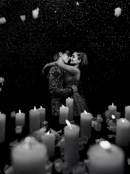 A classic black and white portrait, using the soft glow of countless candles to create a magical and timeless sangeet night memory. This is an example of my fine art photography style.