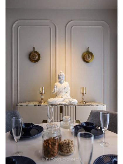 A detailed shot of the dining setup in the 'Atmosphere' project. The elegant table setting against the backdrop of the serene Buddha statue creates a perfect ambiance for mindful dining.