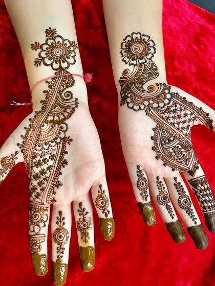 A beautiful example of an Arabic floral design. The pattern is asymmetrical and leaves plenty of open skin, making the bold flowers and leaves pop.