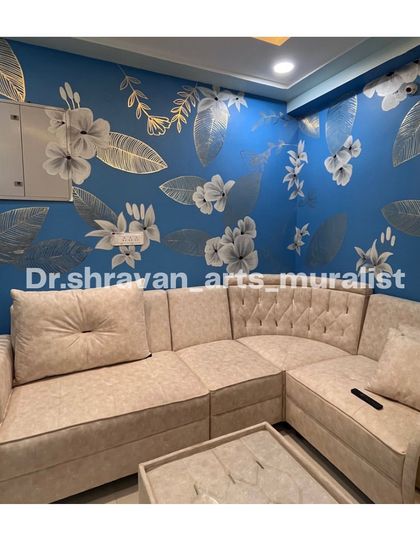This gold and silver foil mural was completed in just 6 hours for a client in Mumbai. The cool blue wall with metallic florals creates a chic and relaxing living room corner.