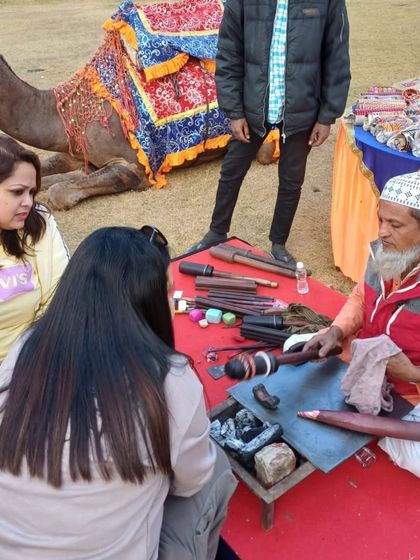 It's all about the details. At the Rajasthani fair we curated for the EXL offsite, we included local artisans, like this bangle maker, to give participants a hands-on cultural experience. Even a camel made an appearance to complete the scene.