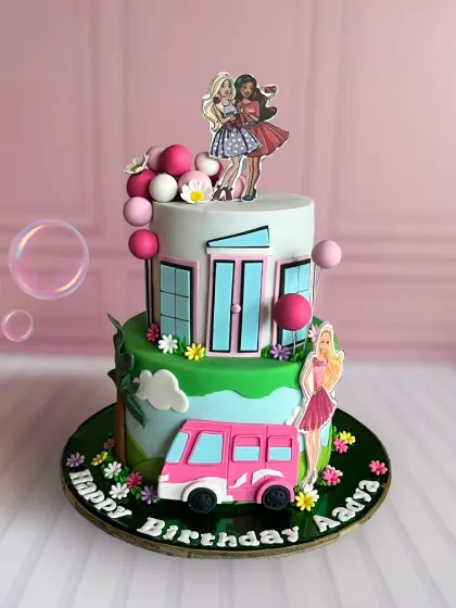 A stylish two-tier Barbie Dreamhouse cake with a pink camper van, perfect for a glamorous and fun-filled birthday party.