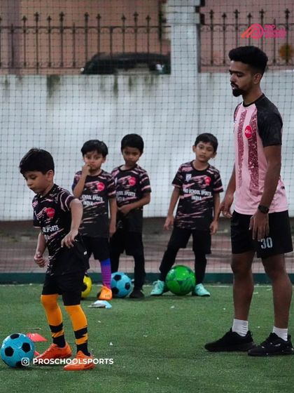 A coach guides our youngest players through a drill, focusing on fundamentals and fun.