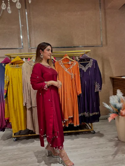 This stunning wine-colored suit features intricate floral embroidery and a rich, lustrous fabric. I styled it with statement earrings and modern transparent heels to create a look that is both traditional and contemporary, perfect for Diwali or a wedding.