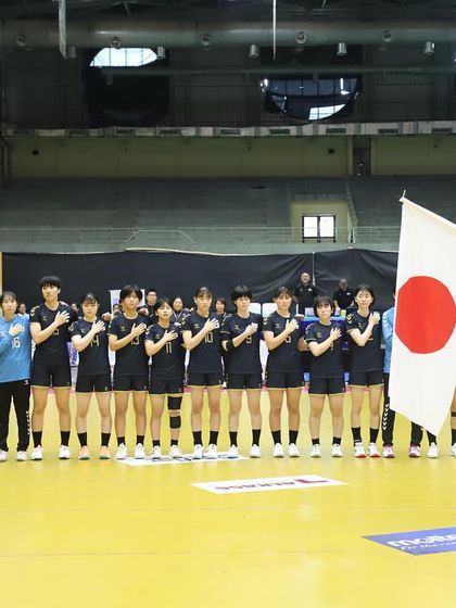 The Japanese women's handball team lines up for their national anthem. We provide a respectful and professional environment for all visiting international delegations.
