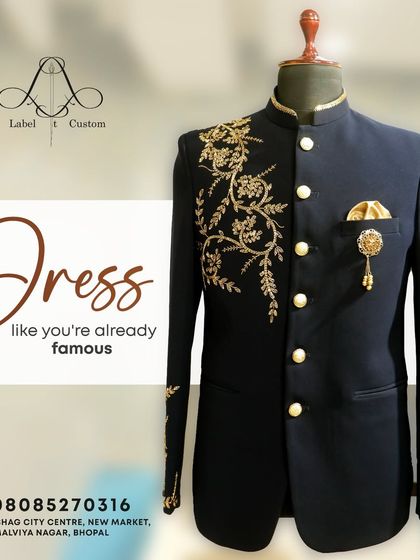 Dress like you're already famous. This graphic showcases a navy blue Bandhgala with stunning gold zardosi work on the shoulder, a truly famous look.