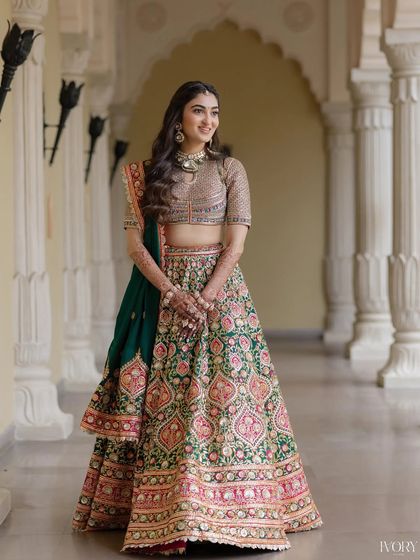 A full-length shot showing the gorgeous flow of the carnival lehenga. The soft makeup and hair are the perfect complement.