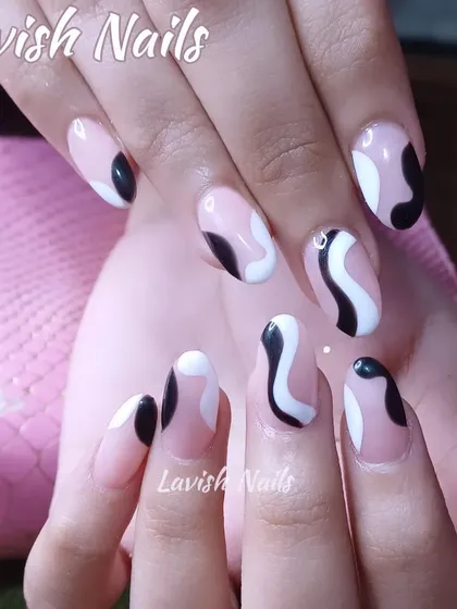 A modern and chic abstract design with black and white shapes on a sheer pink base, perfect for an artistic look.