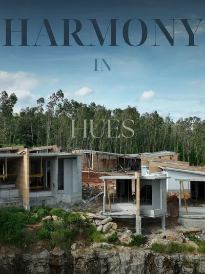 Harmony in Hues. During construction, the soft tones of the raw concrete and wood blend beautifully with the forested backdrop.