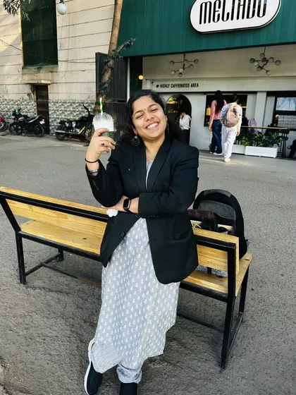 Taking a quick break outside a cafe. While the work is serious, I believe in the importance of finding moments to relax and recharge.