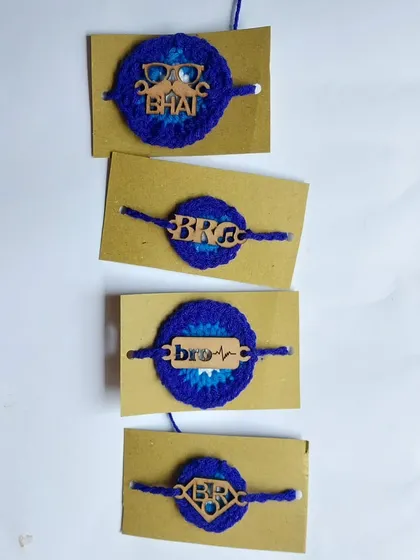 For the trendy brother, I offer these crochet rakhis with cool MDF charms like "Bro" and "Bhai." This set is based on an evil eye theme.