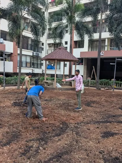 I am on-site, directing the team during the soil preparation phase to ensure the levels are correct across the large area.