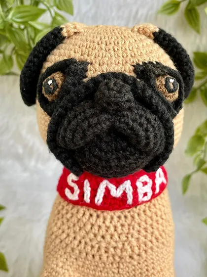 A full view of the "Simba" the pug replica doll. I used special techniques to shape his face and get his sweet, wrinkly expression just right. The collar is even personalized with his name.