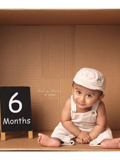 A special delivery of pure cuteness. This little one is celebrating his six-month milestone with a fun "in the box" setup.