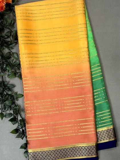 A pure Mysore silk saree in a beautiful multi-tonal Rangkat design, blending yellow, orange, and green.