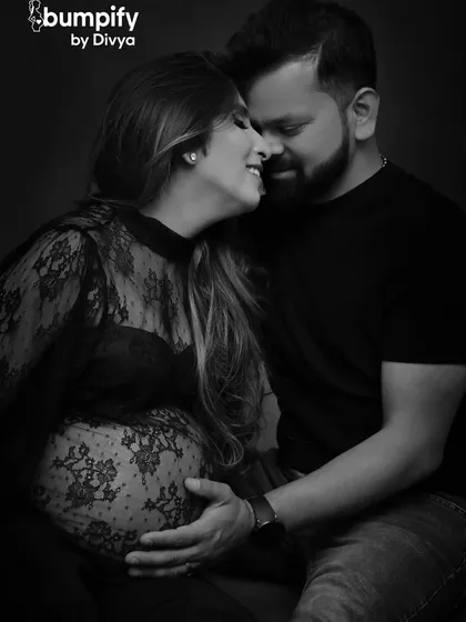 An intimate black and white portrait capturing the pure joy and connection between a couple. These close-up, emotional shots are timeless treasures that focus on the love story behind the bump.
