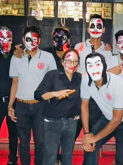 Our staff fully embraces the Halloween theme, joining in on the fun with masks and face paint to create a truly immersive experience.