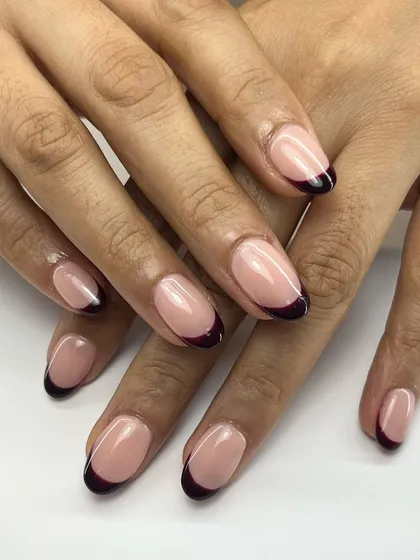 A deep-colored French manicure is simple, yet so elegant. Using a dark, vampy shade for the tips creates a sophisticated and modern look on almond-shaped extensions.