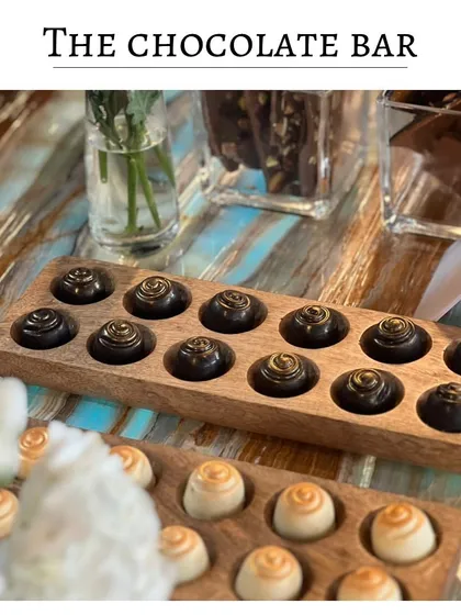 My version of a chocolate bar, featuring handcrafted dark and white chocolate bonbons. This is a perfect addition to a dessert station for true chocolate lovers.