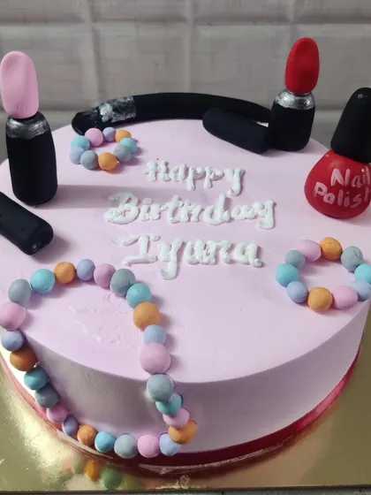 A fun and stylish makeup-themed cake for Iyuna's birthday. It's decorated with edible lipsticks, nail polish, and jewelry made from fondant.