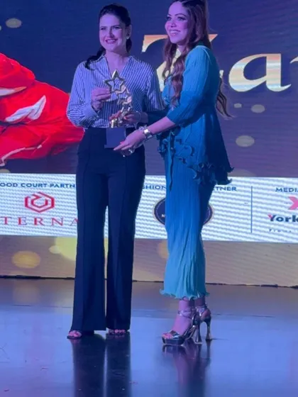 Receiving an award from Zareen Khan on stage was a truly unforgettable moment. This is a snapshot from that journey.