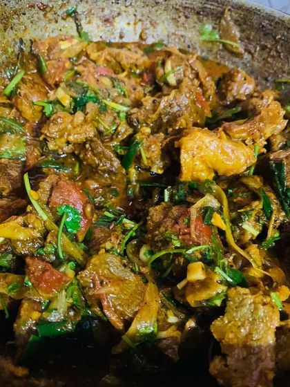 A delicious beef fry from today's menu, full of spices and fresh herbs.