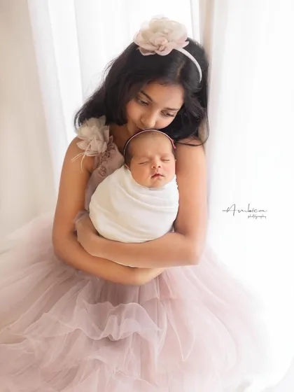 "Mere do anmol Ratan," my two precious pearls. This image captures the sweet, protective instinct of an older sibling.