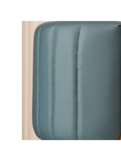 A detail of the channel-stitched upholstery on the arm of the accent chair. This technique adds texture and a sense of luxury to the piece, making it a true statement chair.