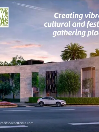 The entrance to a modern development, designed to be a vibrant cultural and festive gathering place. The combination of striking architecture, artistic sculpture, and thoughtful landscape creates an inviting atmosphere for community events and daily enjoyment.