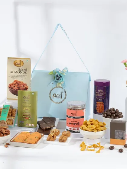 Our gifting expertise isn't just for sweets. We create beautiful hampers that include our premium range of savory snacks like Soya Chipstix, salted almonds, and gourmet crackers.