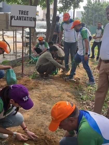 The Aramco team in action, planting saplings along the creek. Their support is crucial for maintaining and enhancing our restored green spaces.